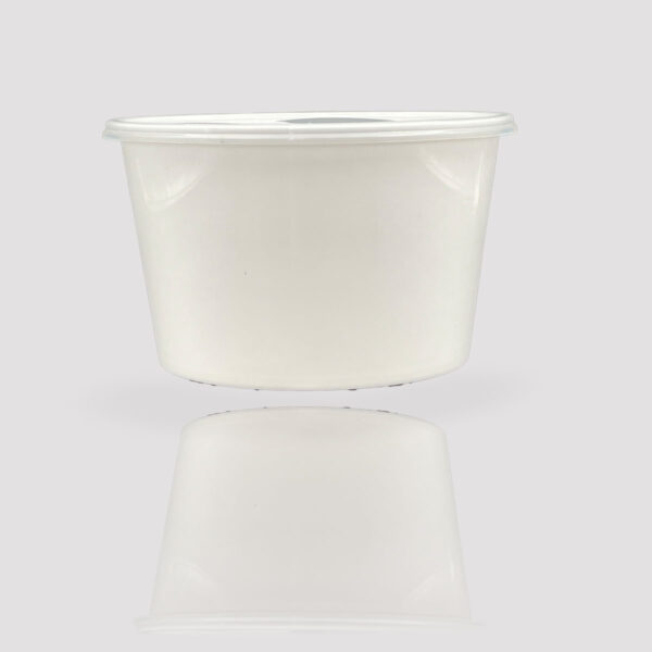 plastic container 500ml round white with bit shadow in the background.